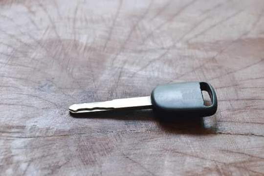 single car key on table